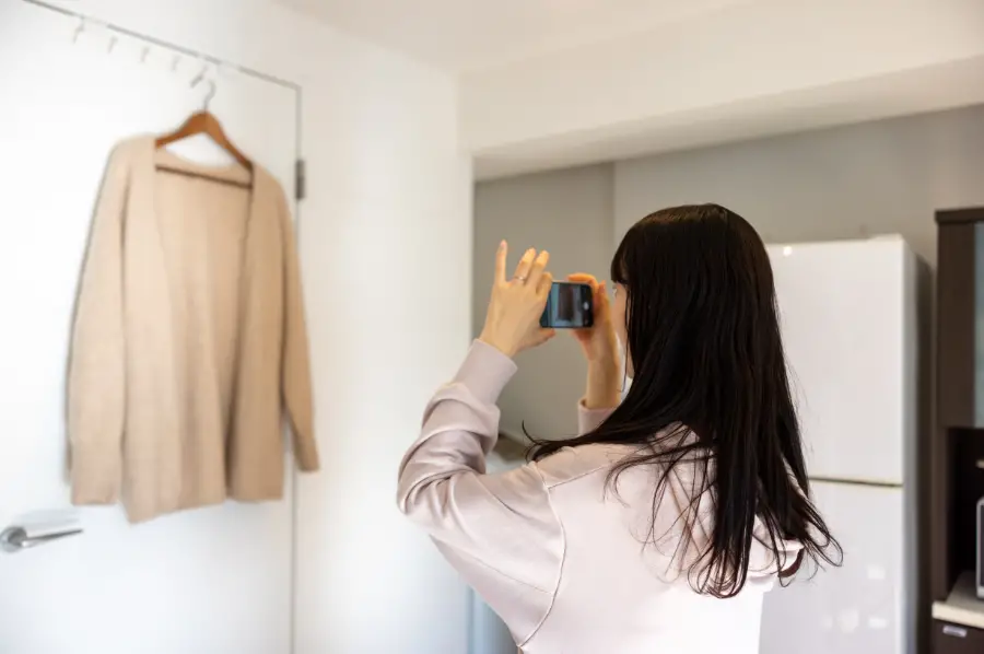 Taking photos of clothes for wardrobe planning